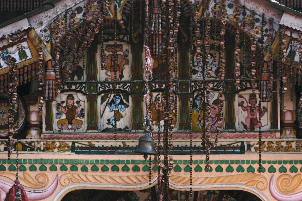 Intricately decorated Hindu temple facade showcasing vibrant sculptures and spiritual motifs in Hanol, India.